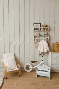 Stylish Composition of Cozy Scandinavian Interior of Children's Room with an Armchair